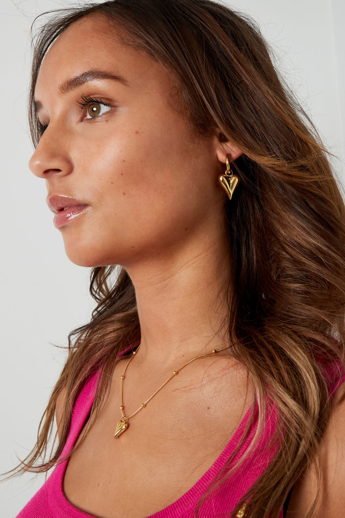 Boucles d'oreilles avec pendentifs coeur medium - doré