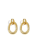 Boucles d'oreilles imposantes avec pendentif ovale détaillé